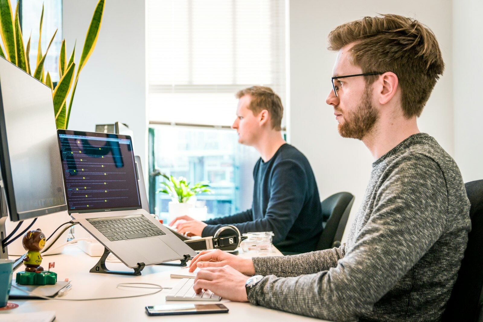 Two developers looking at a screen